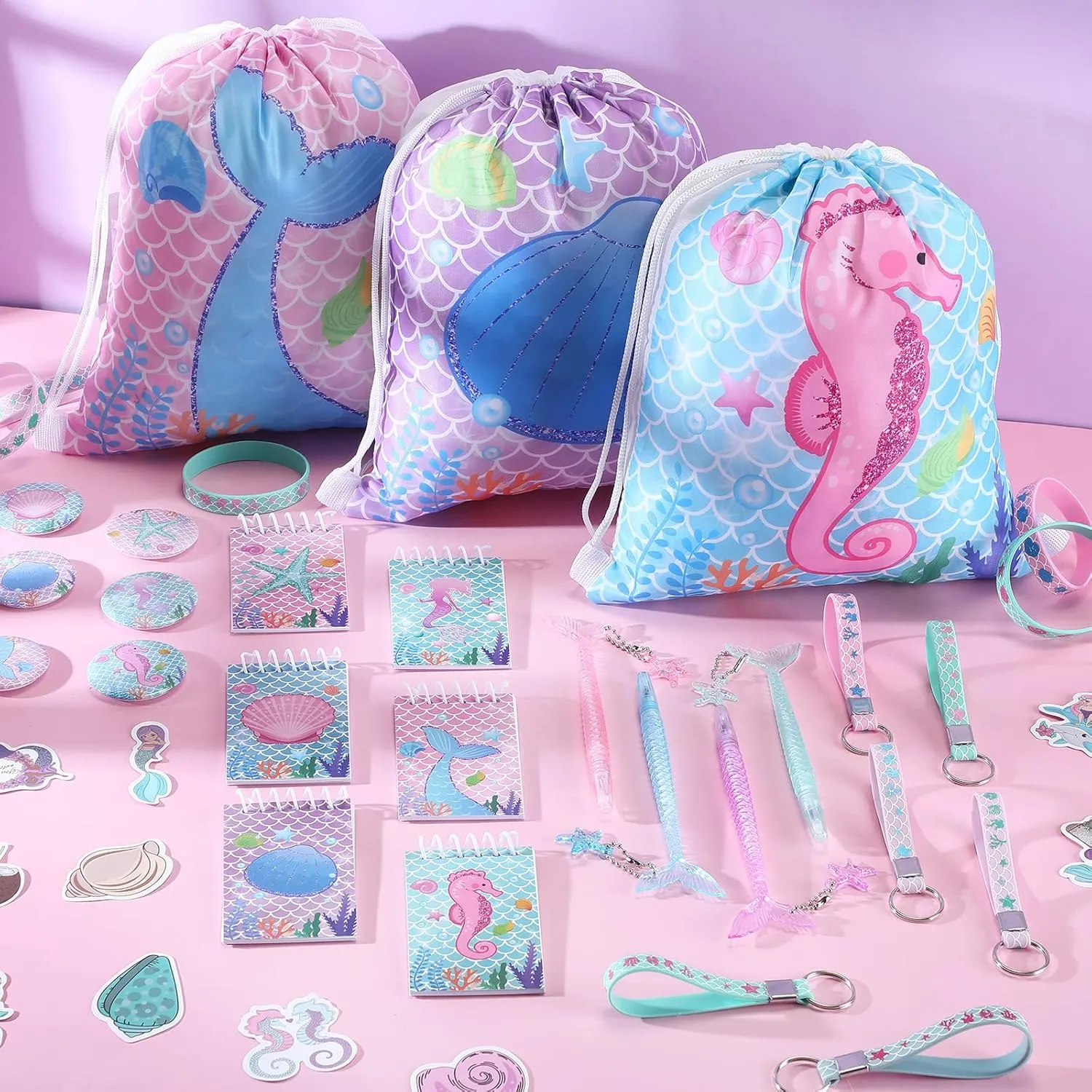 Sherr 140 Pcs Mermaid Gift Bags Party Favors for Girls Birthday Decorate Supplies Include Drawstring Bags Silicone Bracelets Keychains Pens Stickers Notebooks Pinata Stuffers (Mermaid)